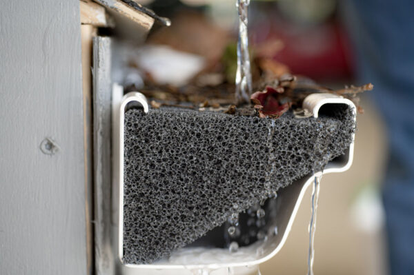 Foam gutter guards closeup, side view cutaway